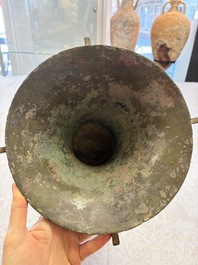 A Chinese archaic bronze wine vessel with Taotie design, Zun 尊, late Shang