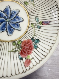 A Chinese famille rose cup and saucer with floral design, Yongzheng