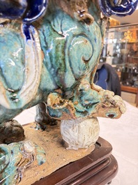 A pair of large Chinese polychrome-glazed Shiwan stoneware Buddhist lions, 19th C.