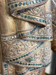 A very large Burmese mica-inlaid gilt-lacquered wooden Mandaly Buddha, 20th C.