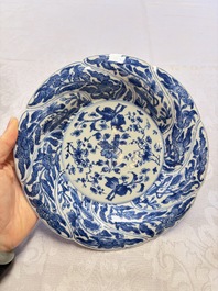 Eleven Chinese blue and white gadrooned 'Flowers and Peacocks' plates, Kangxi
