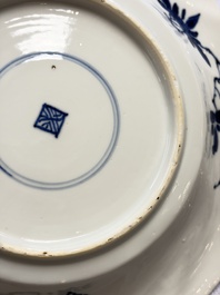 Eleven Chinese blue and white gadrooned 'Flowers and Peacocks' plates, Kangxi