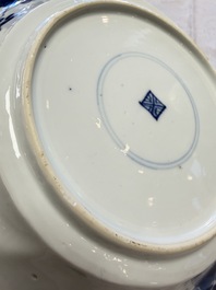 Eleven Chinese blue and white gadrooned 'Flowers and Peacocks' plates, Kangxi