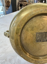 A fine Chinese bronze censer with loop handles and stand, Xuande mark, 18th C.