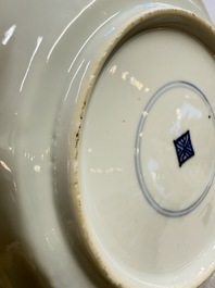 Eleven Chinese blue and white gadrooned 'Flowers and Peacocks' plates, Kangxi