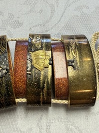 A fine Japanese four-case metal-inlaid lacquer 'Kanshin' inrō by Kōzan with a red coral ojime and a 'Jurojin' netsuke, Kōzan 光山 mark, Edo