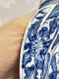 Eleven Chinese blue and white gadrooned 'Flowers and Peacocks' plates, Kangxi