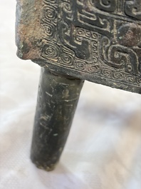 An inscribed Chinese archaic bronze food vessel with Taotie design, Ding 鼎, Western Zhou