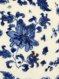 Eleven Chinese blue and white gadrooned 'Flowers and Peacocks' plates, Kangxi