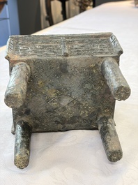 An inscribed Chinese archaic bronze food vessel with Taotie design, Ding 鼎, Western Zhou
