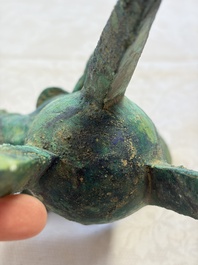 A Chinese archaic bronze wine vessel with Taotie design, Jue 爵, late Shang
