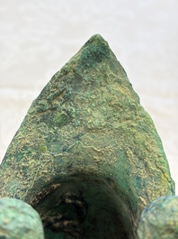A Chinese archaic bronze wine vessel with Taotie design, Jue 爵, late Shang