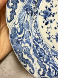 Eleven Chinese blue and white gadrooned 'Flowers and Peacocks' plates, Kangxi