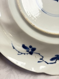 Eleven Chinese blue and white gadrooned 'Flowers and Peacocks' plates, Kangxi