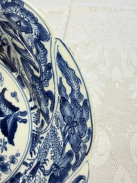Eleven Chinese blue and white gadrooned 'Flowers and Peacocks' plates, Kangxi
