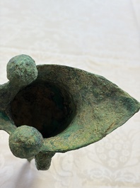A Chinese archaic bronze wine vessel with Taotie design, Jue 爵, late Shang