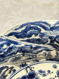 Eleven Chinese blue and white gadrooned 'Flowers and Peacocks' plates, Kangxi