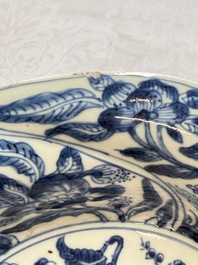 Eleven Chinese blue and white gadrooned 'Flowers and Peacocks' plates, Kangxi