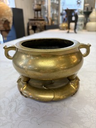 A fine Chinese bronze tripod censer and stand, Xuande mark, 17/18th C.