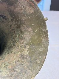 A Chinese archaic bronze wine vessel with Taotie design, Zun 尊, late Shang