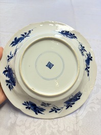 Eleven Chinese blue and white gadrooned 'Flowers and Peacocks' plates, Kangxi