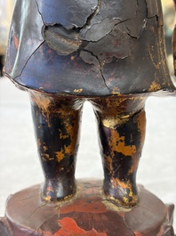 A rare Chinese gilt-lacquered bronze Buddha standing on a lotus throne, Ming