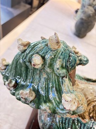 A pair of large Chinese polychrome-glazed Shiwan stoneware Buddhist lions, 19th C.