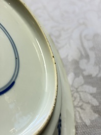 Eleven Chinese blue and white gadrooned 'Flowers and Peacocks' plates, Kangxi