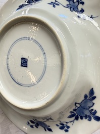 Eleven Chinese blue and white gadrooned 'Flowers and Peacocks' plates, Kangxi