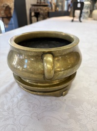 A fine Chinese bronze censer with loop handles and stand, Xuande mark, 18th C.