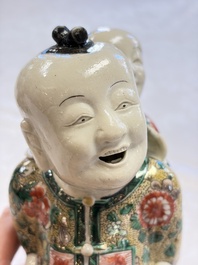 A pair of Chinese verte biscuit 'Piggyback Boys' groups, Kangxi