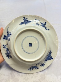 Eleven Chinese blue and white gadrooned 'Flowers and Peacocks' plates, Kangxi