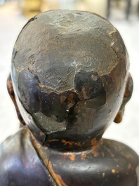 A rare Chinese gilt-lacquered bronze Buddha standing on a lotus throne, Ming