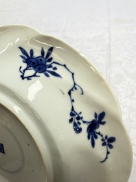 Eleven Chinese blue and white gadrooned 'Flowers and Peacocks' plates, Kangxi