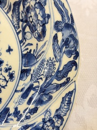 Eleven Chinese blue and white gadrooned 'Flowers and Peacocks' plates, Kangxi