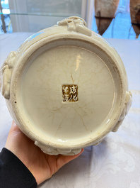 A Chinese Nanking white-glazed 'hu' vase with figural relief design, 19th C.