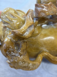 A fine Chinese soapstone group of Buddhist lions on wooden stand, 19th C.