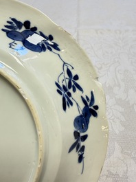Eleven Chinese blue and white gadrooned 'Flowers and Peacocks' plates, Kangxi