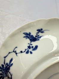 Eleven Chinese blue and white gadrooned 'Flowers and Peacocks' plates, Kangxi