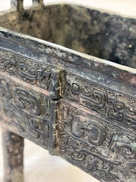 An inscribed Chinese archaic bronze food vessel with Taotie design, Ding 鼎, Western Zhou