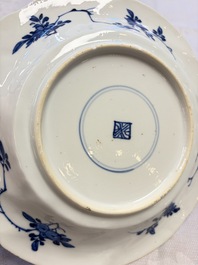 Eleven Chinese blue and white gadrooned 'Flowers and Peacocks' plates, Kangxi