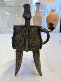 A Chinese archaic bronze wine vessel with owl design, Jia 斝, late Shang
