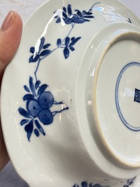 Eleven Chinese blue and white gadrooned 'Flowers and Peacocks' plates, Kangxi