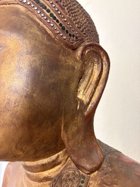 A very large Burmese mica-inlaid gilt-lacquered wooden Mandaly Buddha, 20th C.