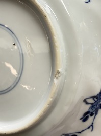 Eleven Chinese blue and white gadrooned 'Flowers and Peacocks' plates, Kangxi