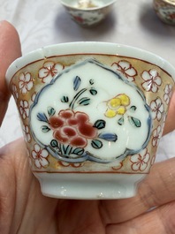 Six Chinese famille rose gilt-decorated 'Flower Basket' cups and saucers, Yongzheng/Qianlong