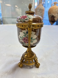 A pair of gilt-bronze-mounted Chinese famille rose capucine-ground vases and a covered bowl, Qianlong