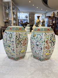 A pair of Chinese famille rose 'Antiquities' vases and covers, 19th C.