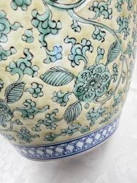 A rare pair of Chinese famille verte yellow-ground 'Flower Scroll' covered vases, Kangxi