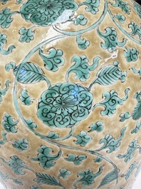 A rare pair of Chinese famille verte yellow-ground 'Flower Scroll' covered vases, Kangxi